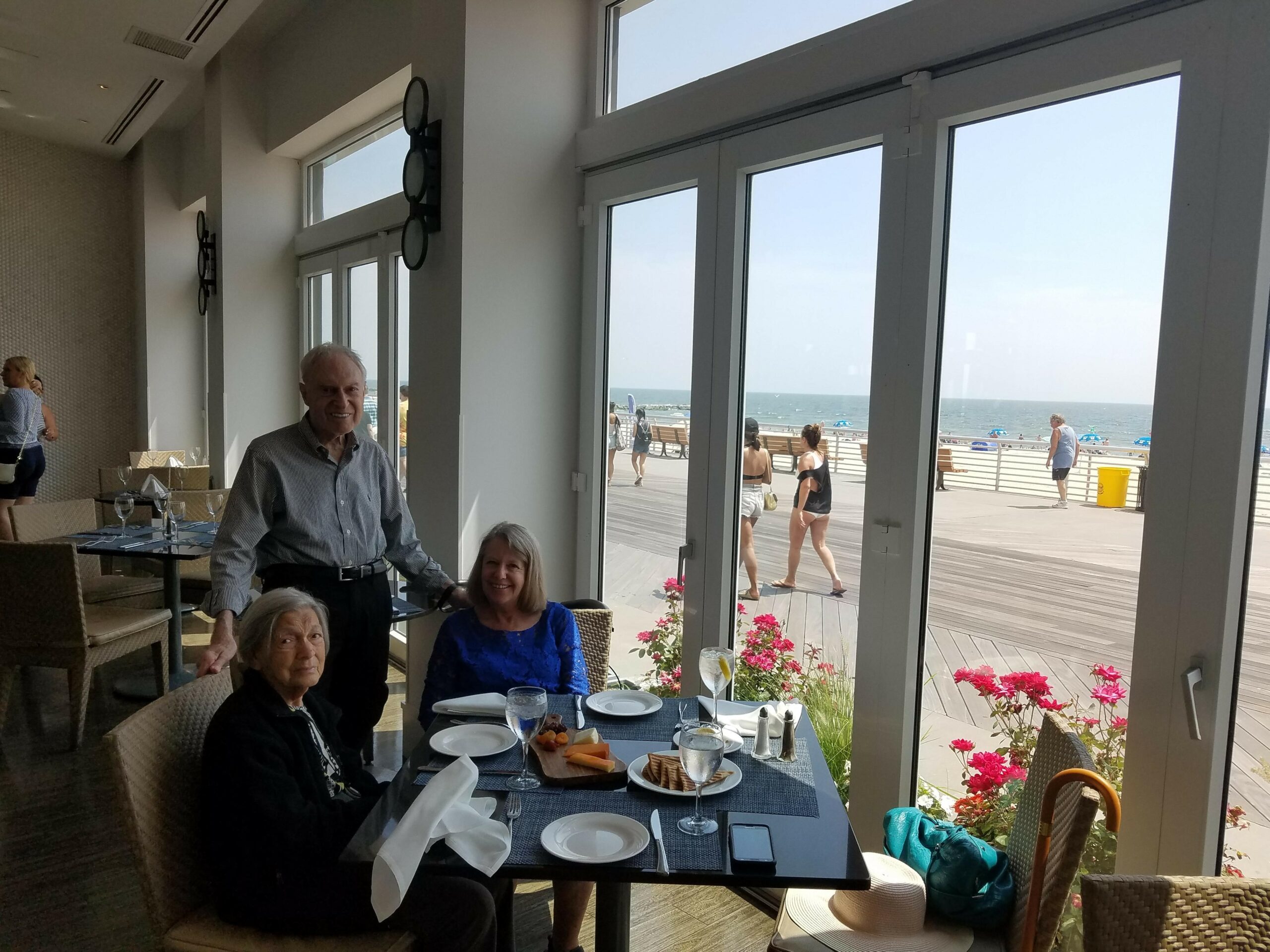 Caryn With Her Clients Having Lunch At The Restaurant